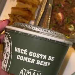 Embalagem de delivery do Atman com a frase: você gosta de comer bem?